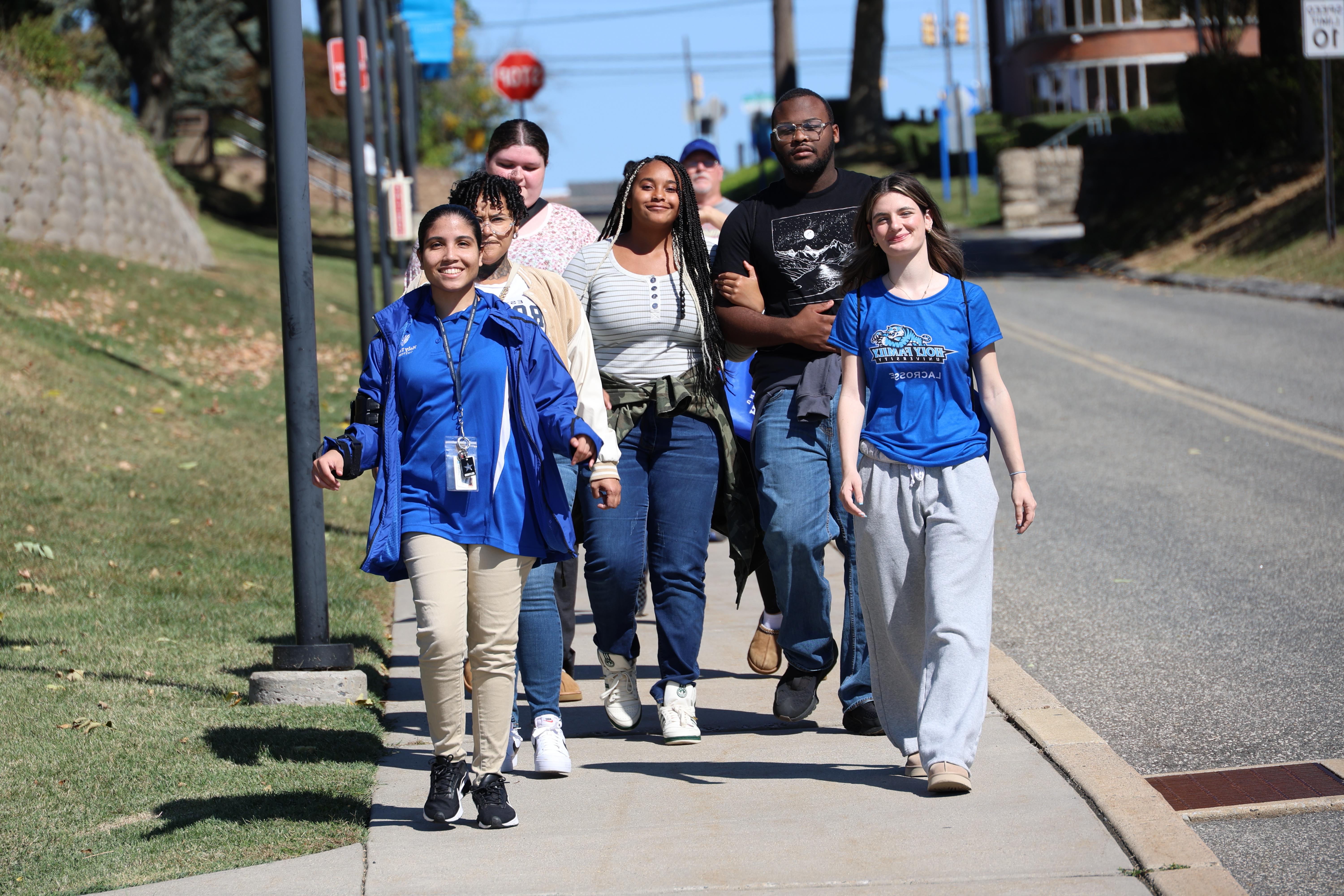 Holy Family students walking down Stevenson Lane.